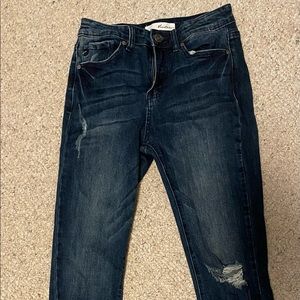 High rise skinny blue jeans, with one hole in the knee